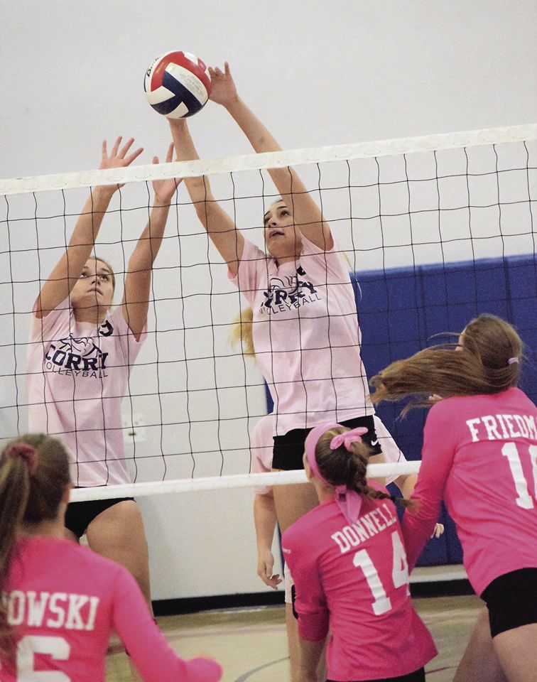 Bugbee and Ciara Davis (right) blocking at the net.